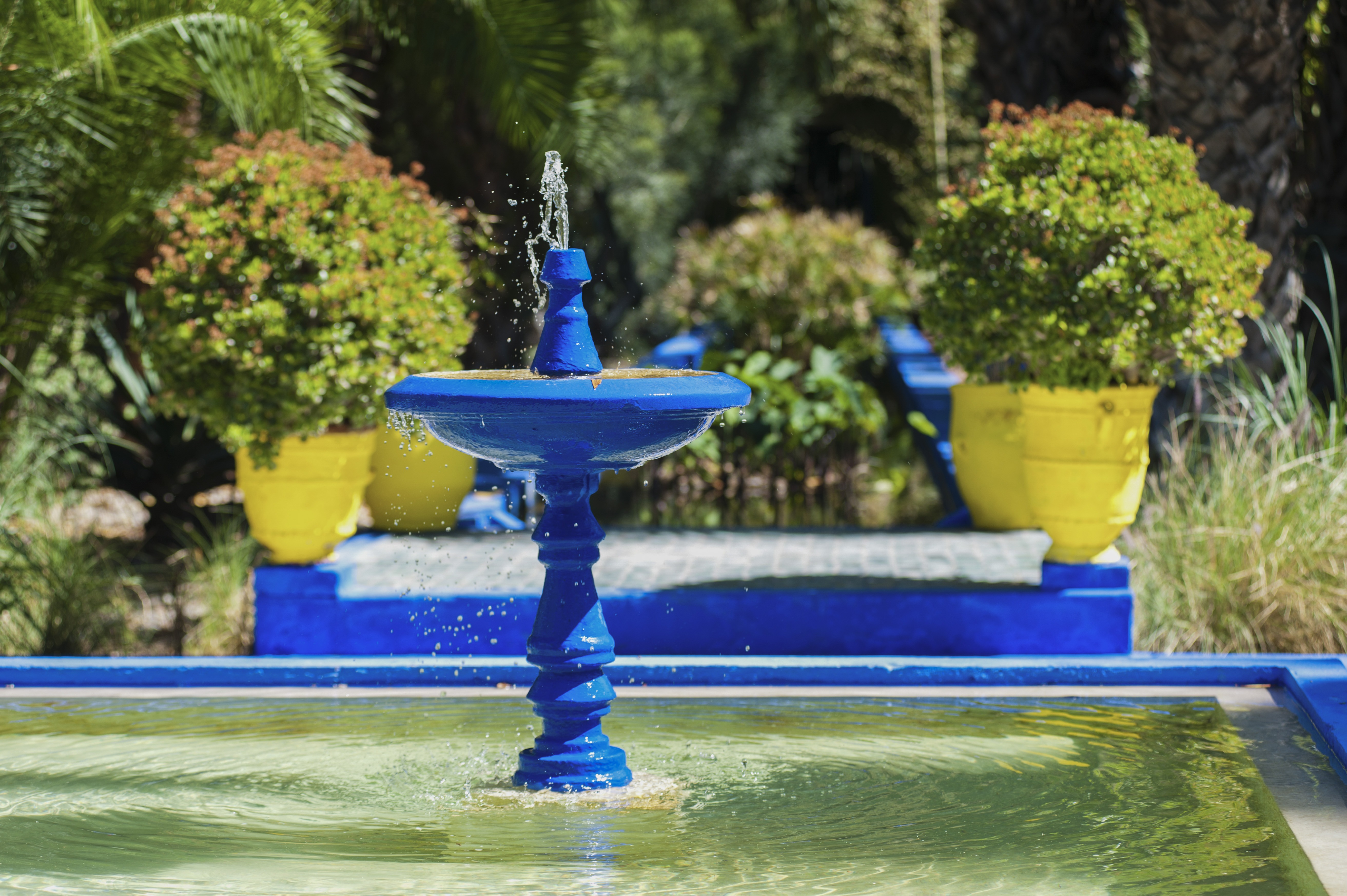 Blue fountain at Majorelle Garden, aka Garden of Yves Saint-Laurent, Marrakech (Marrakesh), Morocco,
